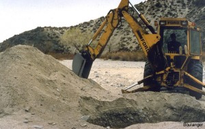 Test pits were excavated by backhoe. This can be a very economical way of rapidly performing shallow explorations in undeveloped areas.