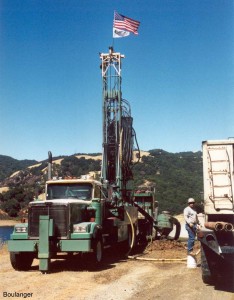  This Becker drilling rig has its mast raised on the rear and is ready for drilling. Becker drilling may be performed as "open bit" or "closed bit", as described below. Sometimes companion holes are drilled side-by-side using the two different techniques.
