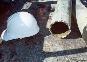 Sampler barrels come in different sizes, like this 6-inch diameter one. The end of the barrel is a cutting bit with tungsten carbide bullets. The sampler barrel is 10-feet long with an additional 10-feet of "slough" barrel above it. This 20-foot long section connects on the end of smaller diameter drill stems. 