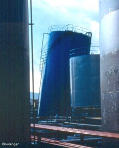 The large blue tank in the middle of the photo tilted excessively due to liquefaction of the foundation soils.