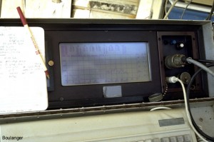 A computer screen shows the data acquisition results while advancing the cone.
