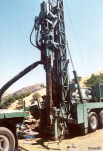 The steel drill stem is driven into the ground by a double-acting diesel hammer. During "closed bit" testing, the casing end is plugged and the casing is driven like a solid penetrometer. The number of blows to drive the casing each foot are recorded, along with the diesel hammer's bounce chamber pressure, and used to infer soil characteristics via empirical relationships.