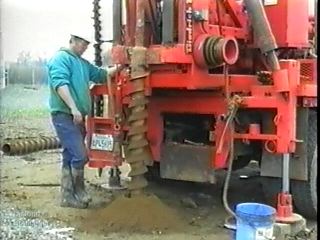 The second main section provides an overview of different drilling methods, including solid and hollow-stem auguring, rotary wash boring, and rock coring. This image shows a hollow-stem augur in action.