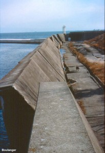 This quay wall along a water channel has deformed outwards due to liquefaction of the fill materials.