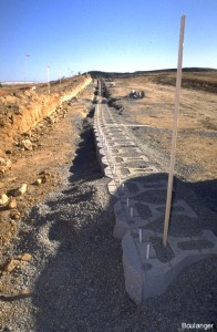 This photo shows a lower row of Keystone blocks, with the geogrid reinforcement extending to the right side.
